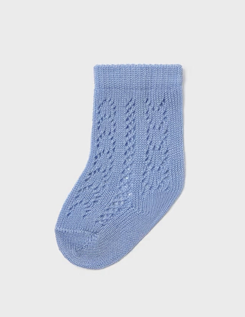 Calzini neonato azzurri in maglia traforata